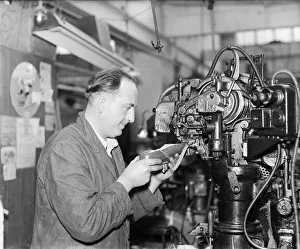 A worker at the Mansfield shoe factory in Northampton stitching a leather upper before