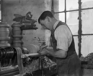 One Man Only Prints: Worker operating a pottery lathe in Doultons Pottery Factory, Lambeth, London