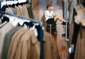 Textiles Prints: A Worker takes a break for a cup of tea at the Burberry polo shirt factory in Treorchy