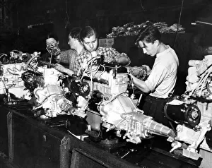 Russia Prints: Workers assembling an engine at the Moskvitch car plant in Moscow. 12th July 1962