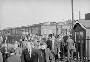 Workers leave Longbridge motor plant in Birmingham after a car delivery on the last day