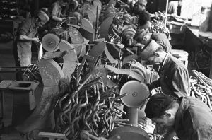 Polishing Prints: Workers on the production line at the Bianchi motorcycle factory in Milan producing