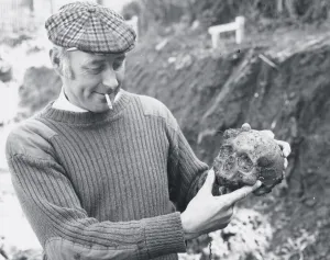 01016 Prints: A workman with the skull uncovered when building the new Herald Express office on Barton
