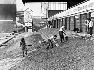 00469 Prints: Workmen are busy preparing the ground before beginning work on the Railway End stand