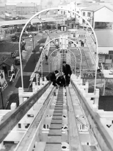 Fairs Prints: Workmen check over the new giant water chute built at Belle Vue