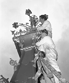 A workmen cleaning the finial of the Queen Elizabeth Tower part of the major overhaul of