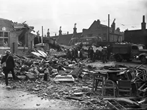 Railway Line Prints: Workmen clear away the rubble following an air raid on Putney, London