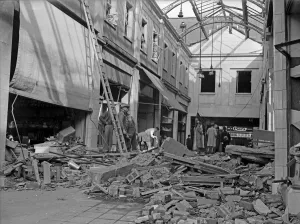 01466 Prints: Workmen inspect the damage to The Arcade in Coventry following a raid on the city