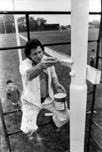 Scaffolding Prints: Workmen painting the 30ft. rugby posts at the Northern Rugby Team ground on 2nd August
