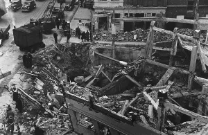 Workmen and rescue services work on the remains of Sloane Square Underground Station in