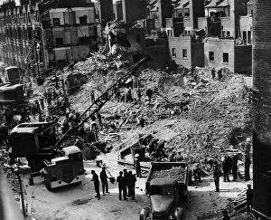 Workmen search a building at Elephant and Castle London which was hit by a German bomb