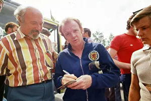 World Cup 1974 Billy Bremner signing autographs after a Scotland training