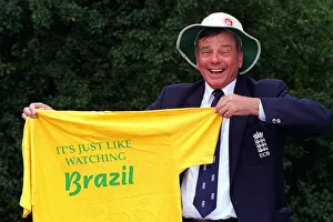 World famous cricket umpire Harold Dickie Bird holding a T-Shirt that barnsley fanswear