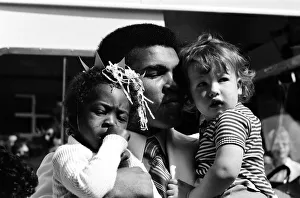 World heavyweight boxing champion Muhammad Ali presented a sunshine coach on the behalf