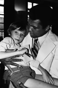 World heavyweight boxing champion Muhammad Ali presented a sunshine coach on the behalf