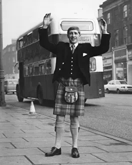 01518 Prints: World Lightweight Champion Ken Buchanan seen here modelling a kilt prior to his trip to