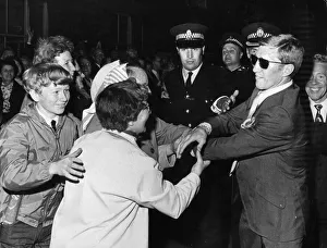 World Lightweight Ken Buchanan is surrounded by exuberant