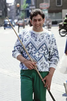 World snooker champion Joe Johnson poses with cue in the street. 28th May 1986