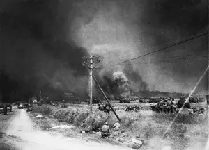 Allies Prints: World War II Invasion of France Allied soldiers take cover during the bombing of