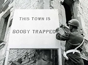 Danger Prints: World War II Invasion of France D-day + 56 A Canadian military policeman seen here