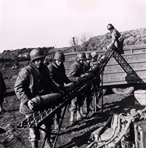 World War II Invasion of France Shells being unloaded by US soldiers into a