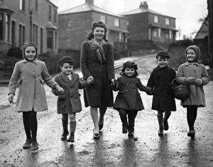 Walk Prints: World war II Women: Domestic scene mother and children take a walk in the village