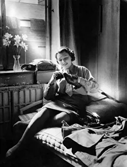 Polishing Prints: World War II Women. A member of the A. T. S. Shines her shoes before Parade
