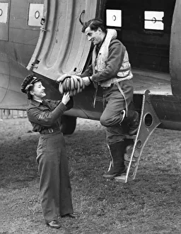 Banana Prints: World War II Women. A pilot arriving from overseas to a Transport Command station handing