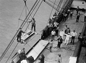 00165 Prints: World War One. A wounded man on a stretcher is lifted on board a hospital ship