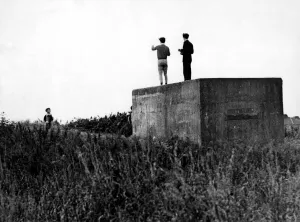 World War Two - Second World War - Children play on a WW2 gun emplacement / pillbox