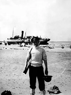 British B Prints: World War Two - Second World War - A naval officer on the beach at Dunkirk prior to