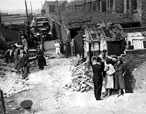 Bombs Prints: World War Two - Second World War - Workmen deal with the results of a German air raid