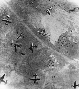 01447 Prints: Wreckage of a twin German aircraft on an enemy airfield after raid by R. A. F