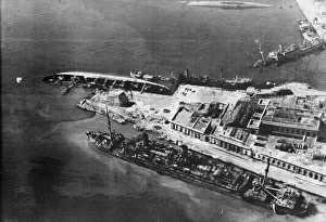 Wrecked and capsized enemy merchant vessels line the quays in the harbour at Naples