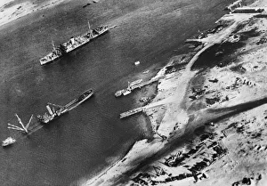 Wreckage Prints: Wrecked merchant vessels in Mersa Matruh harbour after accurate bombing by Allied forces