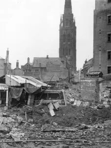 A wrecked van lies in the rubble of ruined buildings in Coventry after the city was