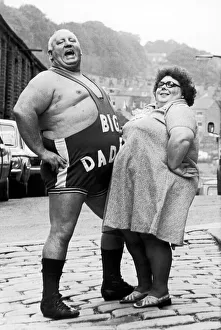 Wrestler Shirley Crabtree alias Big Daddy poses with a fan. 4th September 1980