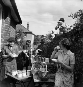 WVS canning centre at Lyminge, Folkestone, Kent. Women turning out 250 cans of fruit a