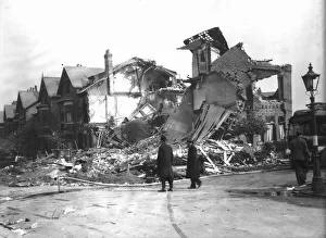00205 Prints: WW2 Air Raid Damage Bomb damage at Liverpool Two police men survey the damage