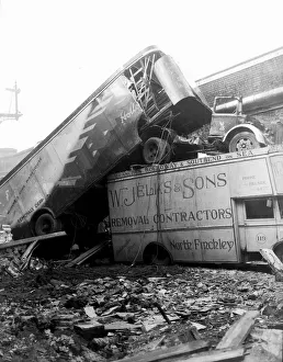 00204 Prints: WW2 Air Raid Damage Removal company trucks sit on top of one another after a raid