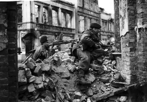 WW2 - April 1945 British Commandos on the look out for snipers among the ruins of