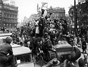 Liberation Prints: WW2 Belgian citizens welcome British troops to Brussels by jumping on a british tank