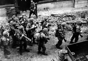 WW2 British and American troops advance through L Eveque France 1944