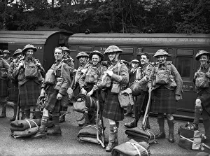 Kilts Prints: WW2 British Scottish Soldiers wearing army tunics and kilts with their kit prepare to