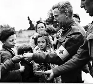 Refugees Prints: WW2 - June 1944 French refugees receive food from British troops