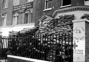 00205 Prints: WW2 London The Blitz Firemen Firemen reading their newspapers outside their