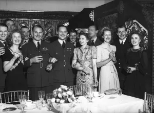 WW2: RAF fighter pilot Douglas Bader and wife Patsy attending party. 29th May 1945