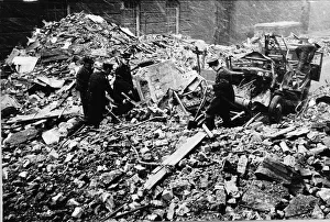 WW2 Rescue workers search rubble Dec 1940 of a building in City Road London