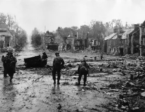 Mines Prints: WW2 Royal Engineers clearing mines from the main street in Tilly-Sur-Seulles