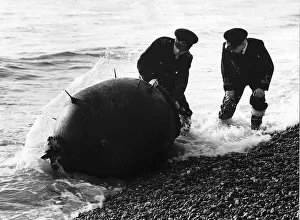 Mines Prints: WW2 Sea Mines December 1945 Two Royal Navy lieutenant commanders defuse a